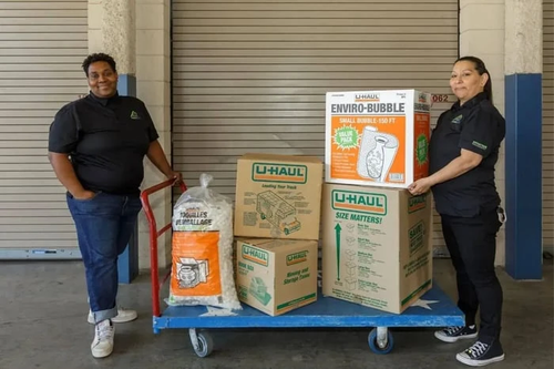 Employees with moving supplies