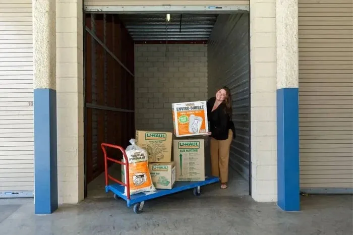 Employee with moving supplies